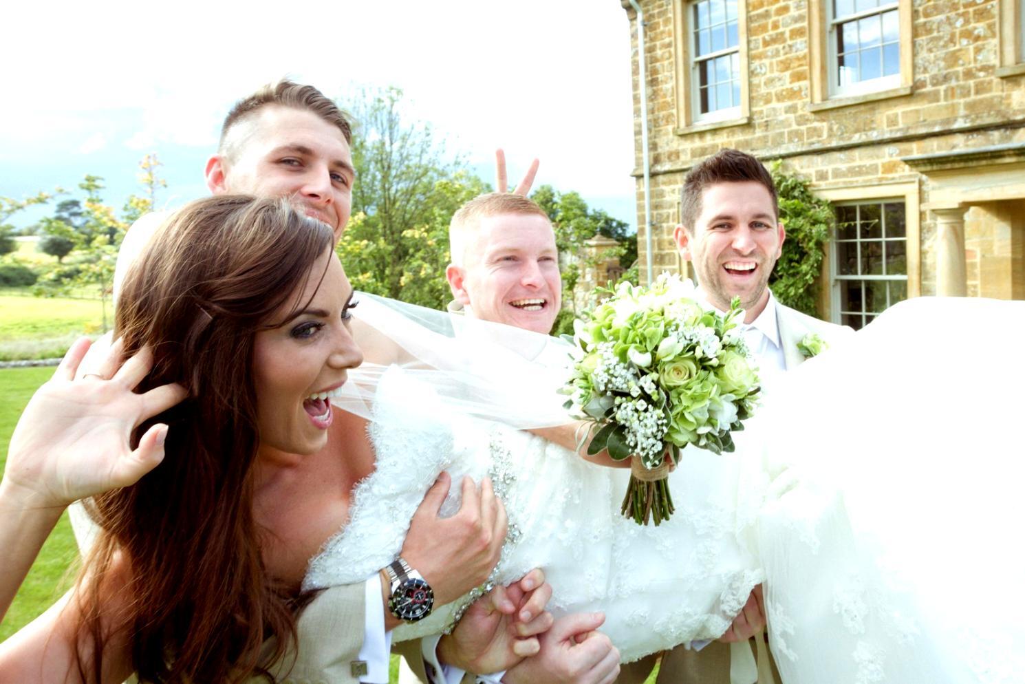 Event planning team reviewing timeline documents and venue layouts during project meeting