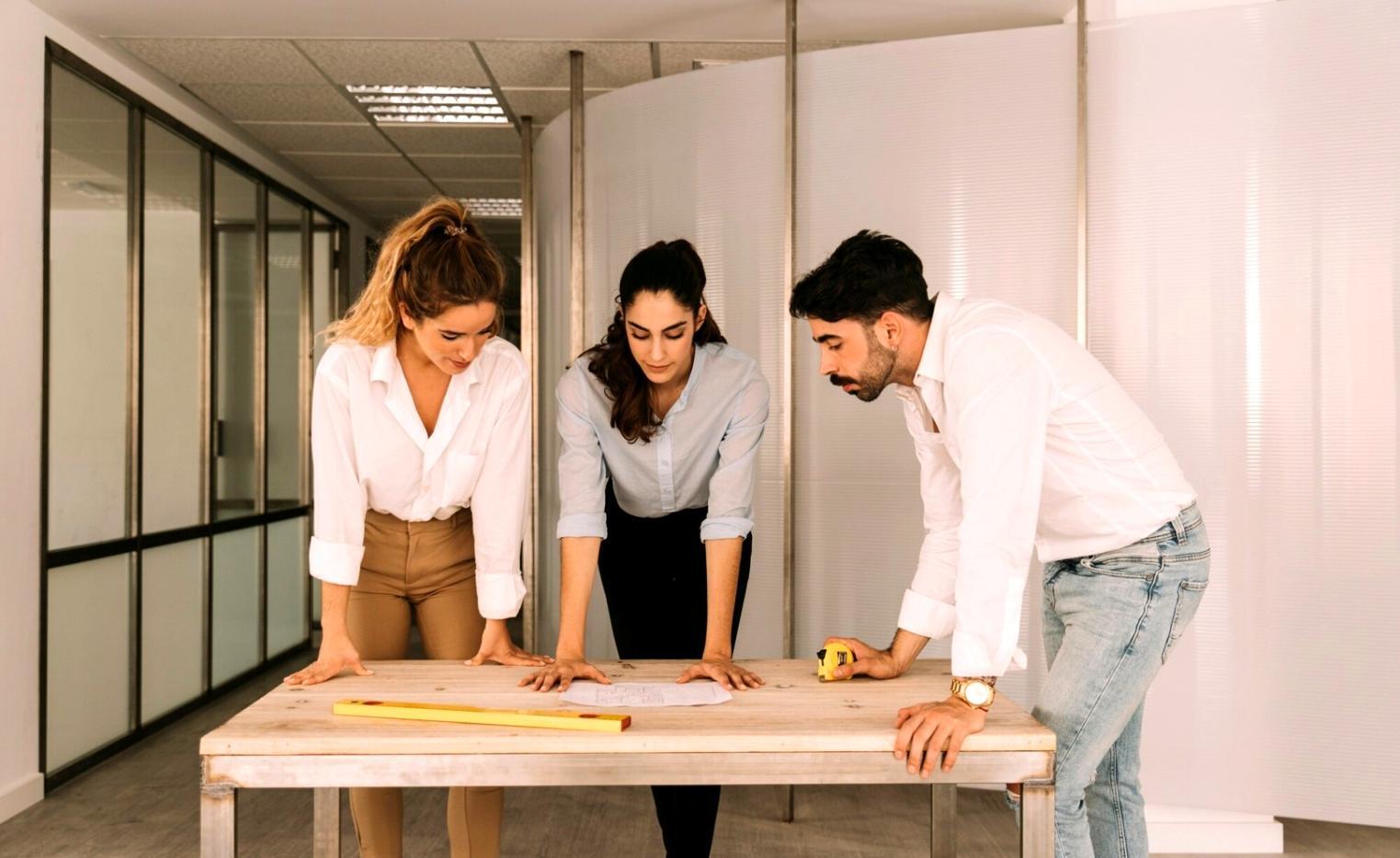 Event management team coordinating final details before corporate conference begins